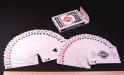 A picture of two decks of cards both spread like fans